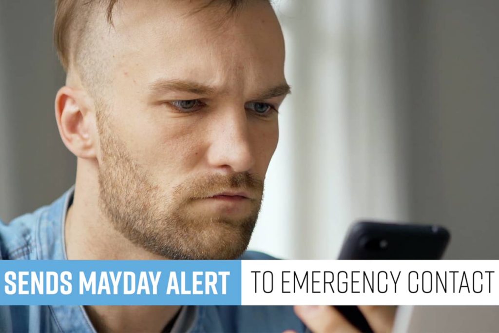 Man looking at phone after receiving mayday alert from dash camera
